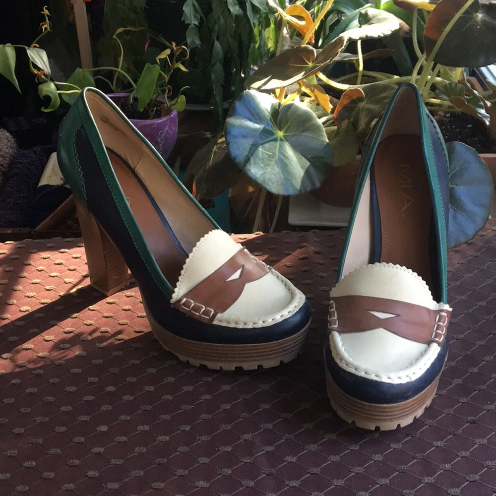 Unique green black and white heels.